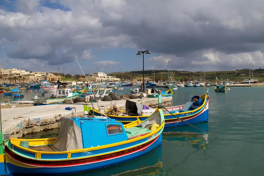 Brightly painted luzzu fishing boats at Marsaxlokk
